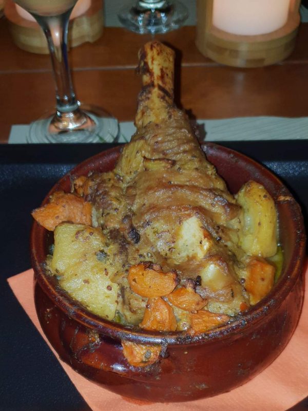 roasted lamb with potatoes and vegetable in ceramic pot - Greece